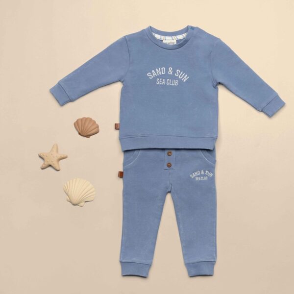 Frogs and Dogs lange broek sand and sun blauw sfeerfoto met schelpen