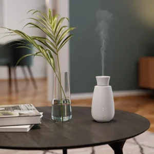 Volatile aroma diffuser Ella wit sfeerfoto salontafel